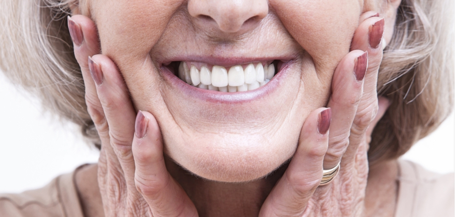 senior women laughing with her dentures